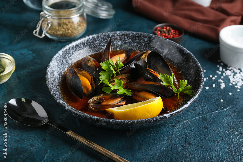 Plate with tasty Mussels Marinara on dark background Plate with tasty Mussels Marinara on dark background