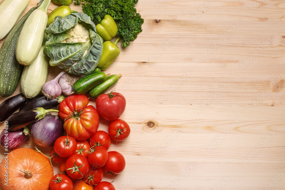 Top view of harvest vegetables, greens on wooden table with copy space Top view of harvest vegetables, greens on wooden table with copy space