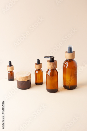 Composition with skin care products on pastel beige background. Close up, copy space