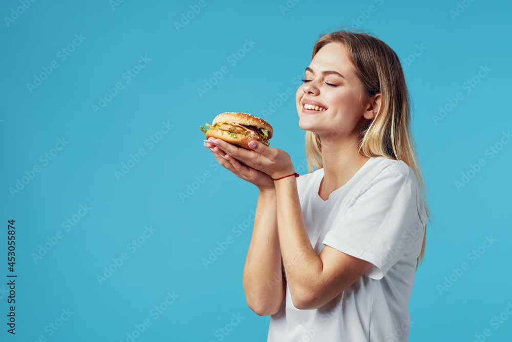 blonde in white t-shirt hamburger fast food snack joy blonde in white t-shirt hamburger fast food snack joy
