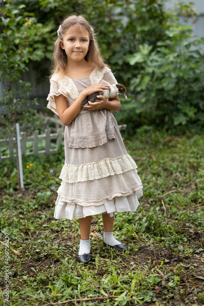 Girl with ducklings Girl with ducklings