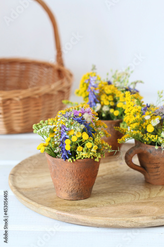 Fototapeta Naklejka Na Ścianę i Meble -  Bouquet of wild flowers in ceramic vase.