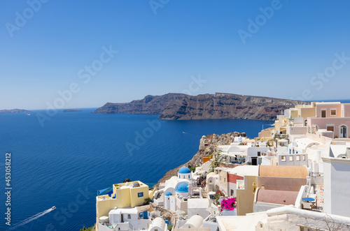 Tourists return to the cliff side accommodation in the village of Oia on the Greek island of Santorini