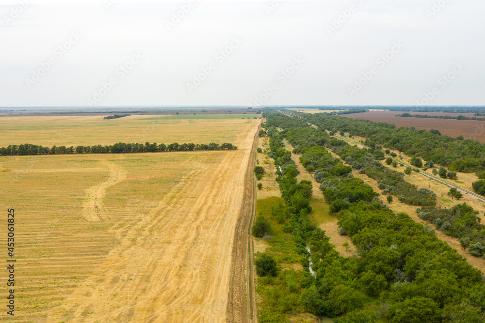 steppe landscape with a canal and a railway view from a quadrocopter
