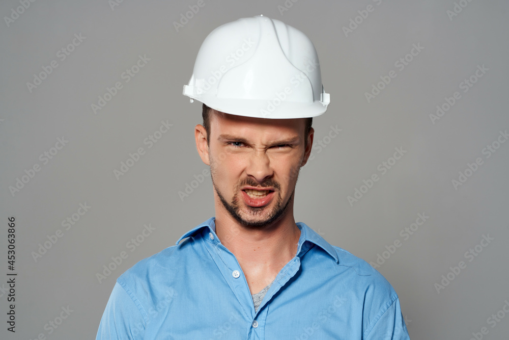 man in working uniform white construction helmet safety professional