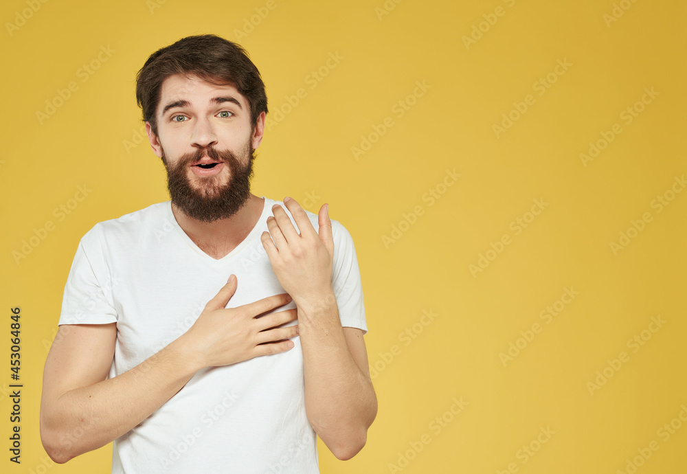 emotional man in a white t-shirt serious look Lifestyle emotional man in a white t-shirt serious look Lifestyle