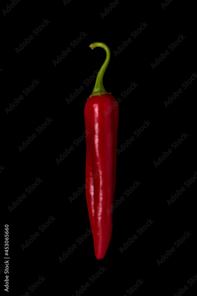 Red hot chili peppers on black background
