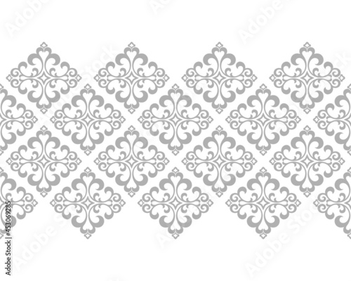 Wallpaper in the style of Baroque. Seamless vector background. White and gray floral ornament. Graphic pattern for fabric, wallpaper, packaging. Ornate Damask flower ornament.