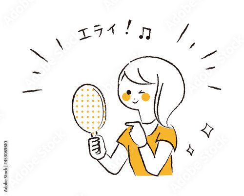 鏡に映る自分を褒めている女性