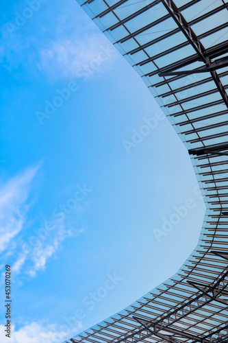 View from below of the iron structure against the blue sky.