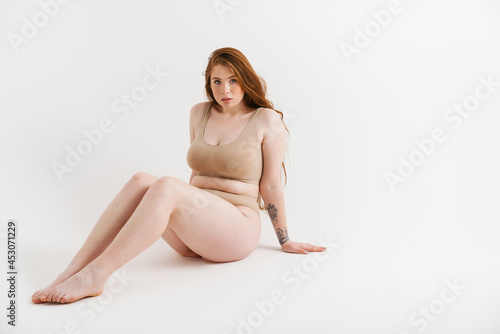 Young white plus size woman wearing lingerie