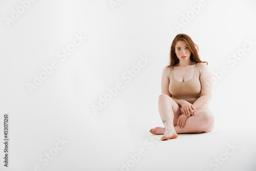 Young white plus size woman wearing lingerie