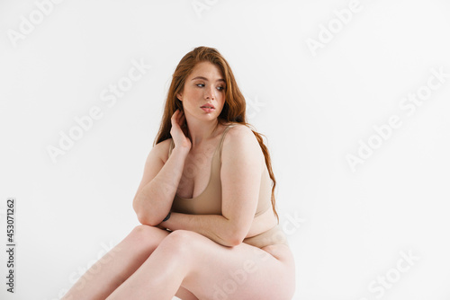 Young white plus size woman wearing lingerie