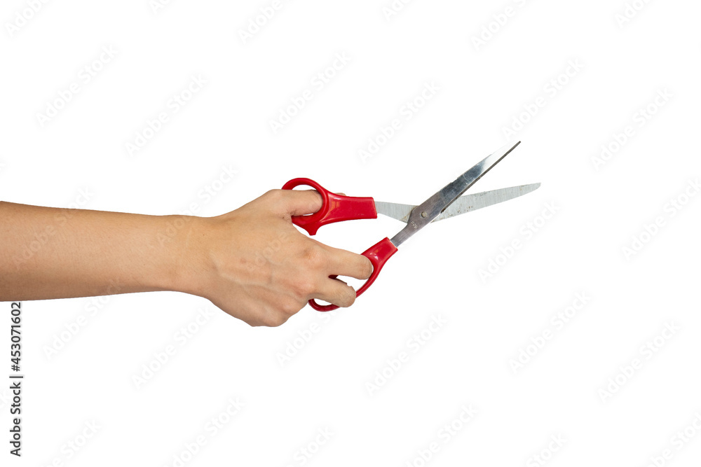 Close up of hand cutting using scissors isolated with white background Close up of hand cutting using scissors isolated with white background
