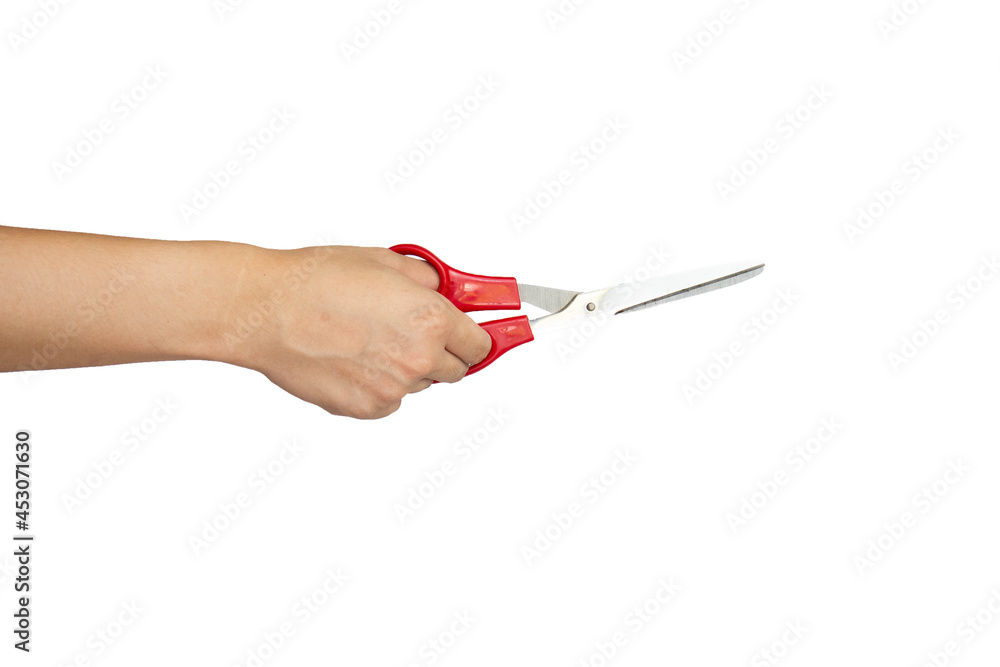 Close up of hand cutting using scissors isolated with white background Close up of hand cutting using scissors isolated with white background