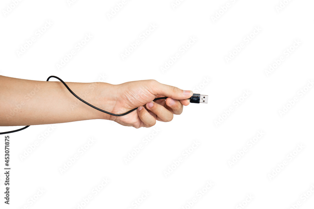 Close up of hand holding USB charging cable isolated with white background Close up of hand holding USB charging cable isolated with white background