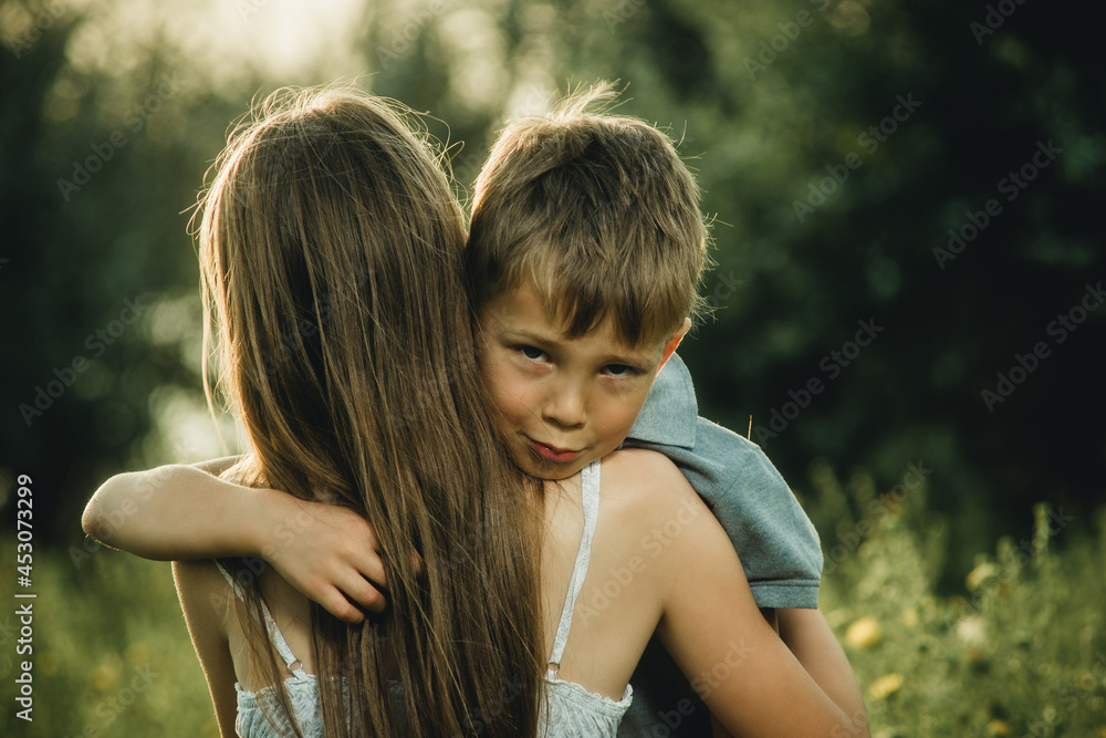 portrait of a little boy who hugged his sister portrait of a little boy who hugged his sister