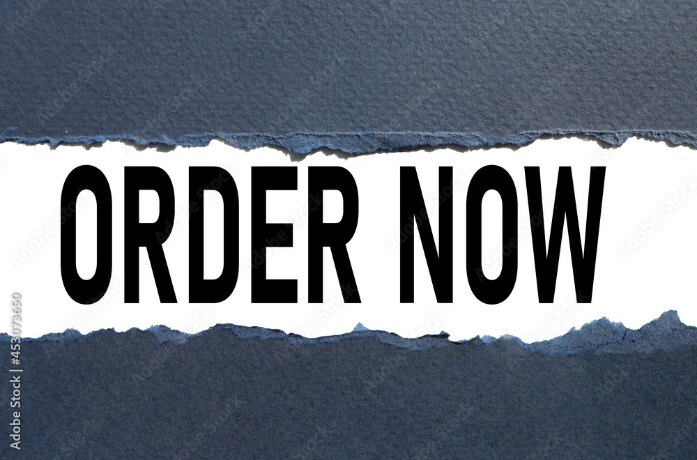 Foto de Order now text on torn paper test in black letters do Stock Foto de Order now text on torn paper test in black letters do Stock