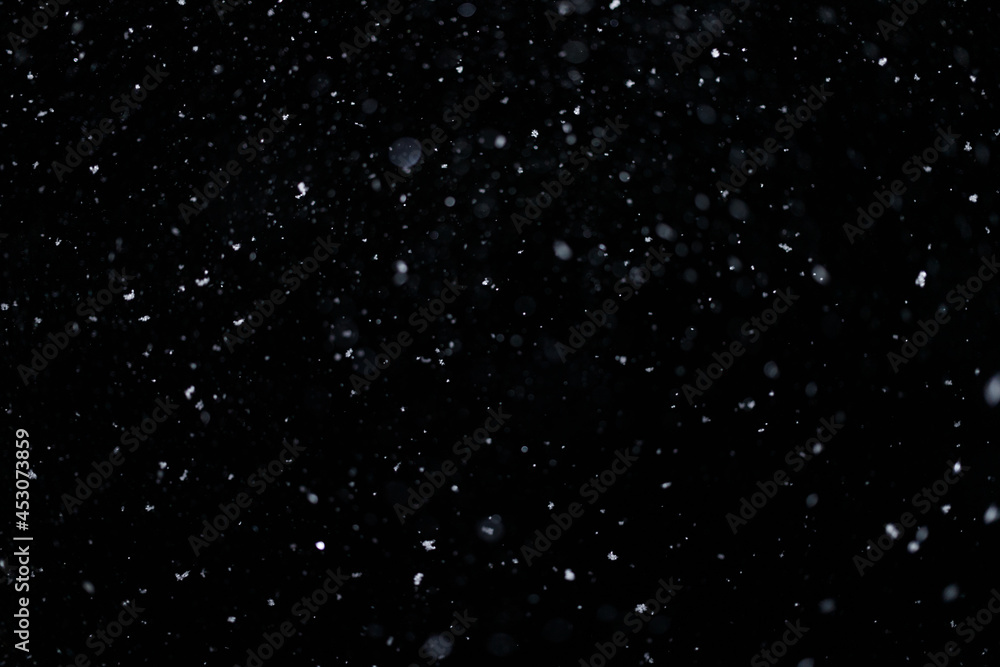 Real falling snow on black background for blending modes in ps. Ver 08 - few snowflakes in blur.