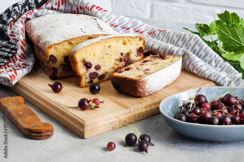 Jostaberry sponge cake on wooden board photo