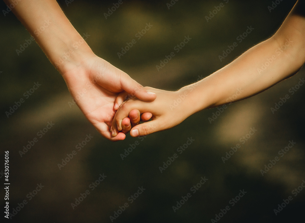 children holding hands close-up for background children holding hands close-up for background