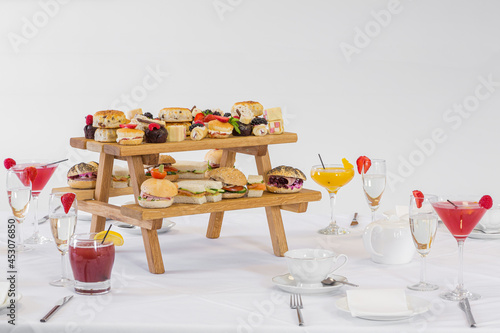A fun champagne afternoon tea served on a mini picnic bench