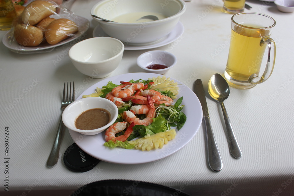 dinner: white plate with shrimps and tea