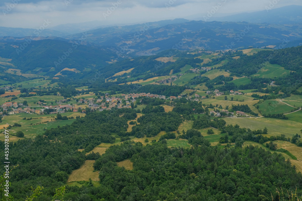 Aerial view of landscape with fields, mountains, woods, and blue sky. natural background.
Aerial view of landscape with fields, mountains, woods, and blue sky. natural background.