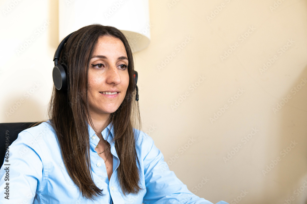 Latin young business woman student teacher tutor wear wireless headset video conference calling on laptop computer talk by webcam learn teach in online chat, distance webinar online teaching concept