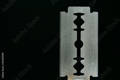 Photography Razor blade on black background. Macro shooting