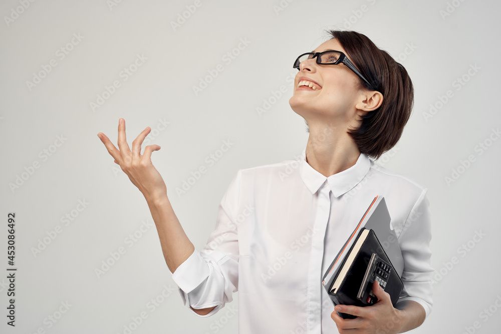 woman in white shirt with documents glasses official woman in white shirt with documents glasses official
