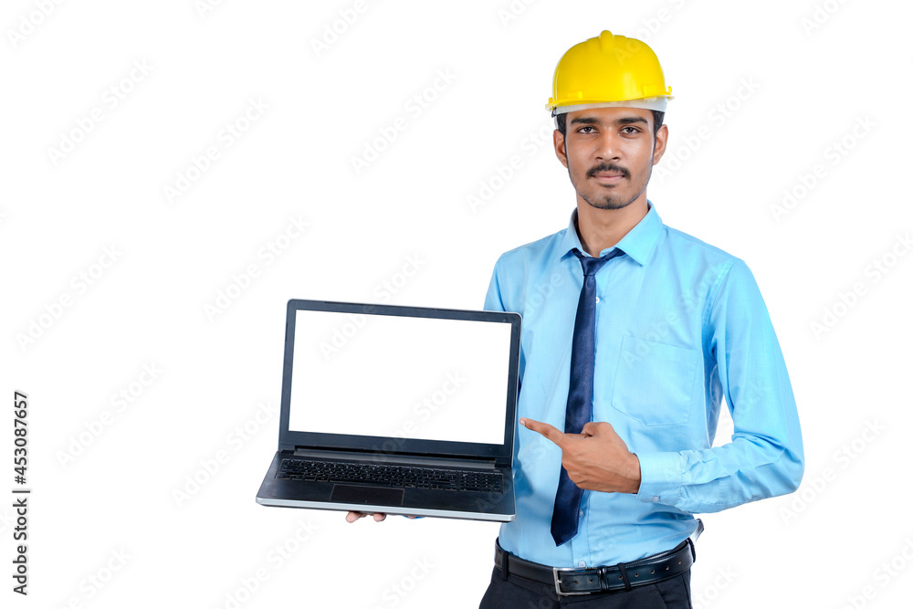 Indian engineer showing laptop empty screen on white background. Indian engineer showing laptop empty screen on white background.