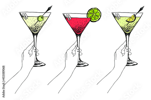 Glass of martini, cosmopolitan and daiquiri in woman hand. Hand drawn sketch. Stock vector illustration.
