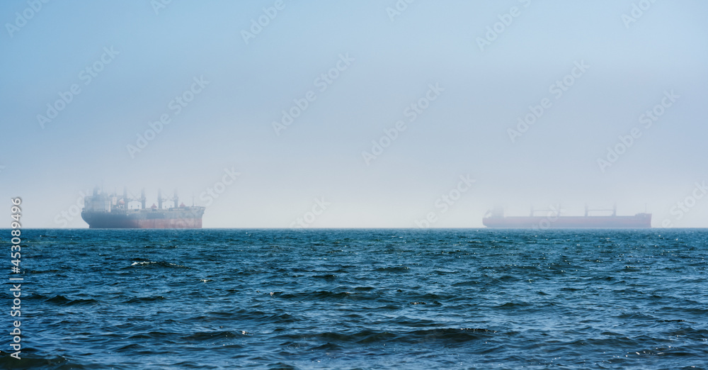 Seascape with fishing vessel on the roadstead.