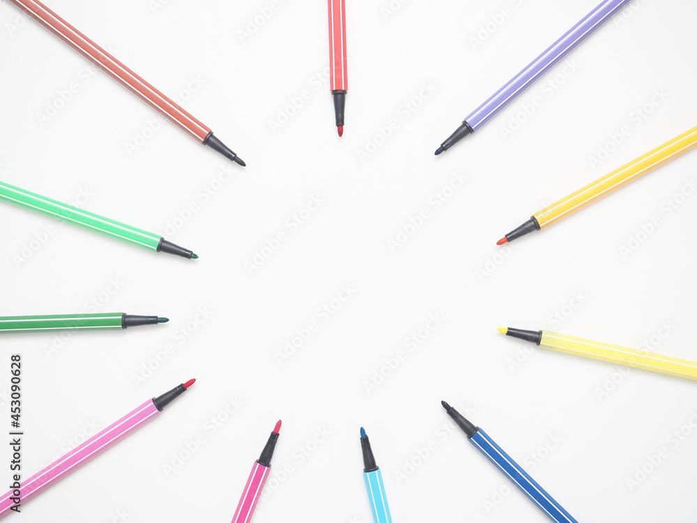 Close up color pen different array circle on white isolated top view copy space