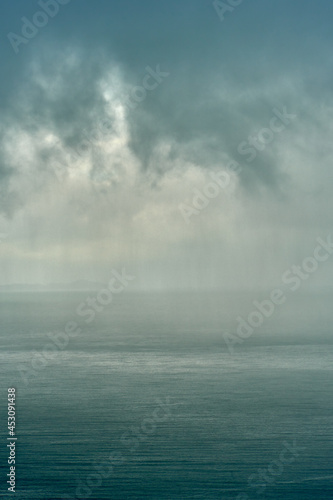 Tropical landscape of the dramatic storm clouds in the rainy weather. © Ruslan Kokarev