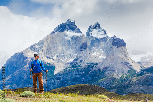 Traveler with Backpack hiking in the Mountains. Travel sport lifestyle concept. Patagonia. Chile