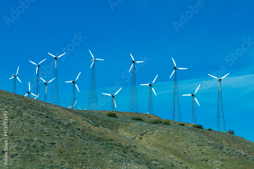 wind generator on a green hill near San Francisco photo