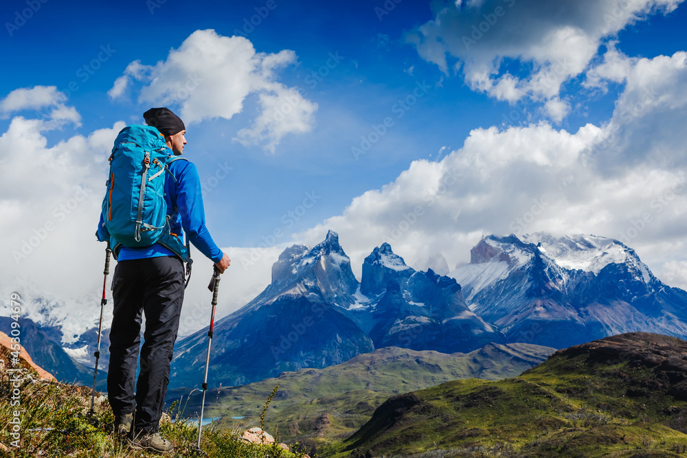 Traveler with Backpack hiking in the Mountains. Travel sport lifestyle concept. Patagonia. Chile Traveler with Backpack hiking in the Mountains. Travel sport lifestyle concept. Patagonia. Chile
