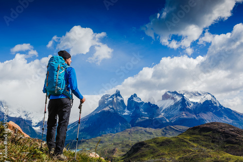 Traveler with Backpack hiking in the Mountains. Travel sport lifestyle concept. Patagonia. Chile