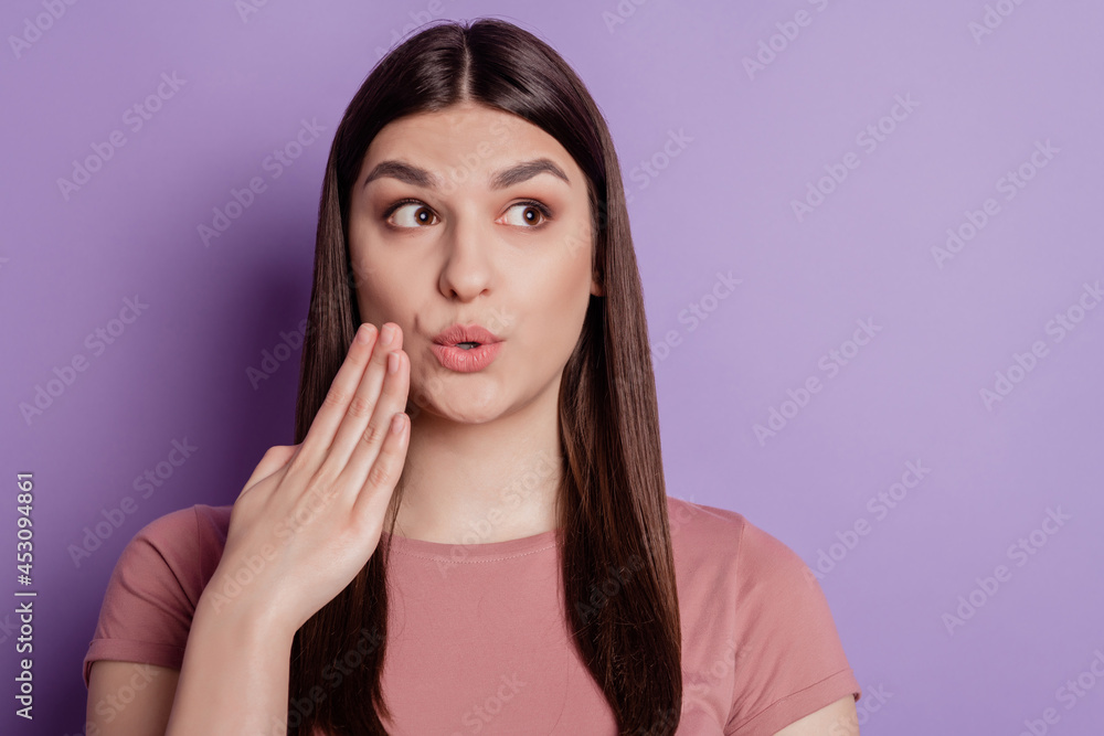Portrait of attractive brunette girl opened mouth hand amazed surprised shocked look empty space isolated over violet background Portrait of attractive brunette girl opened mouth hand amazed surprised shocked look empty space isolated over violet background