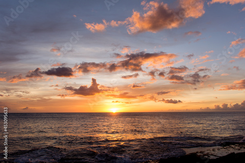 Rainbow Hawaiian cloudy sunset with silhouettes © Cavan