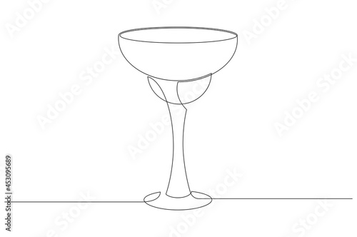 Vector illustration of glass with margarita cocktail in one line style. The element is isolated on a white background.