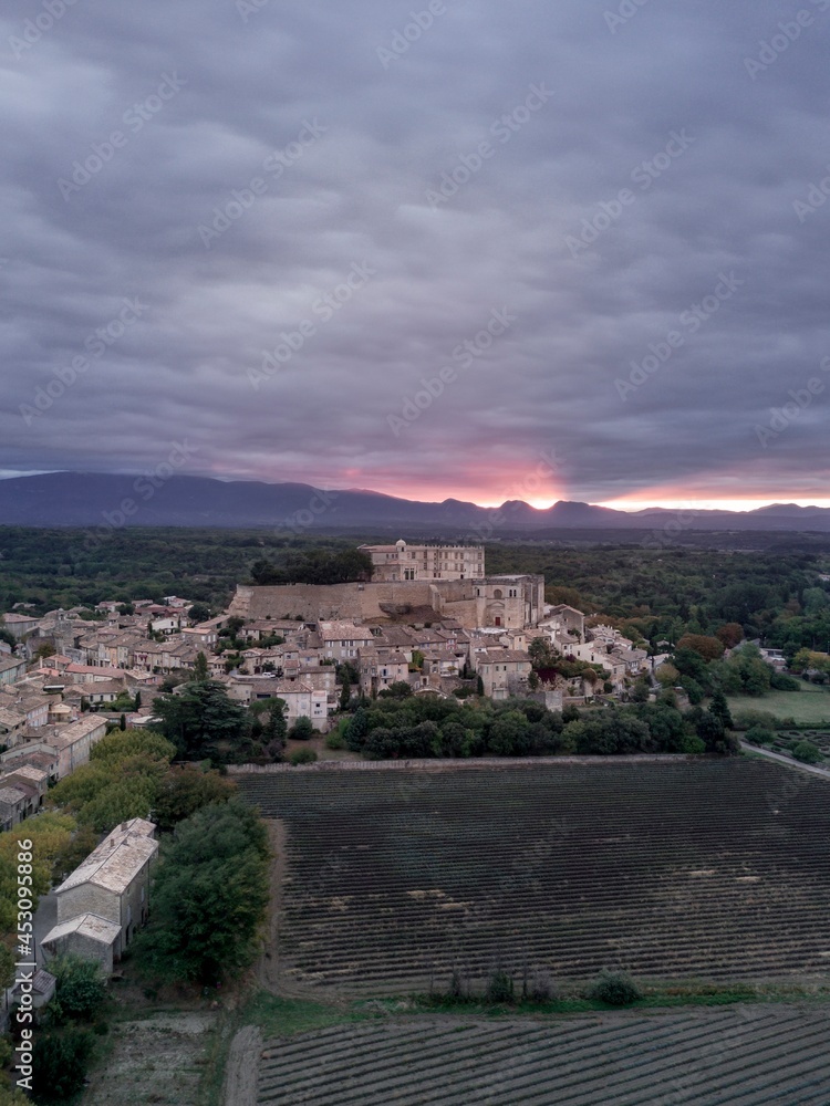 The famous typical Grignan village in provence at sunrise from a