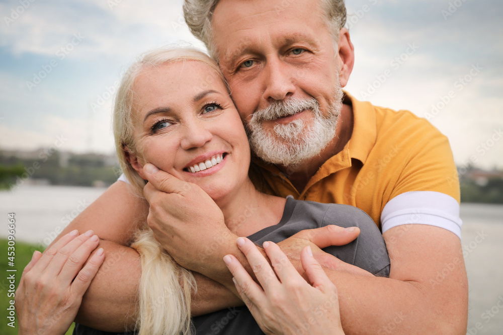 Fototapeta premium Happy mature couple spending time together in park