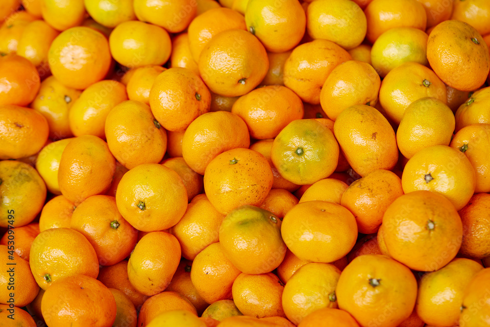 yellow tangerines in the market 