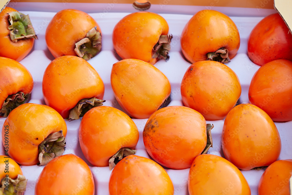 Packed persimmons displayed on the market