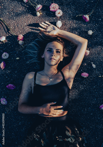 woman on the ground with flowers