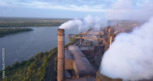 Aerial view of Industrial zone with a large pipe thick white smoke photo