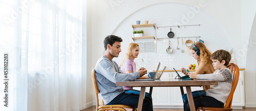 Close up portrait of caucasian family parents daughter and son sit on dining table hands using computer, Together virture live online, home quarantine stay together connect people banner photo